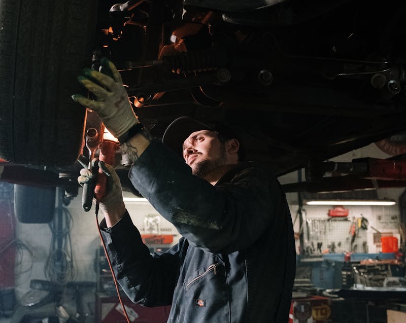 a mechanic working on a car